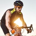 man biking with proper safety gear